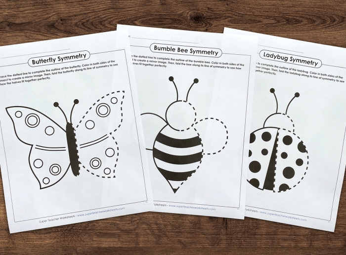 Coloring page featuring a butterfly symmetry worksheet for first graders