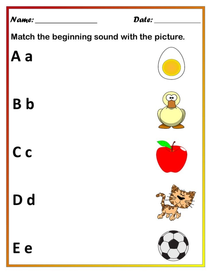 Kindergarten student working on a phonics worksheet to match pictures with the same beginning sounds