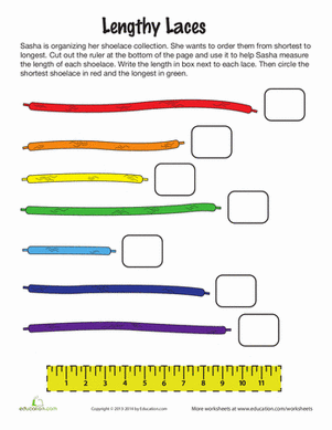 First grade worksheet featuring colorful shoelaces for students to practice measuring lengths in inches with a ruler