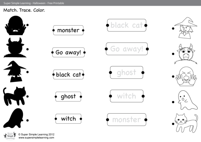 First grade students matching spooky monster cards in a printable memory game