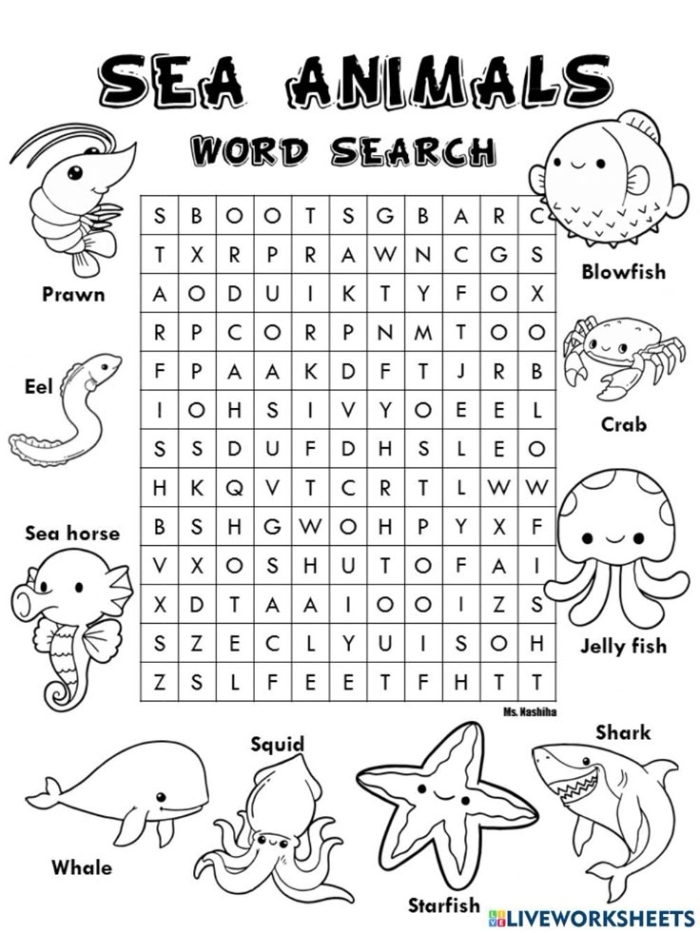 Habitats Word Search Activity: Ocean Animals Puzzle for Elementary Life Science Third grade students completing an ocean animals word search puzzle with blue whale, squid, and shark vocabulary words highlighted in a grid