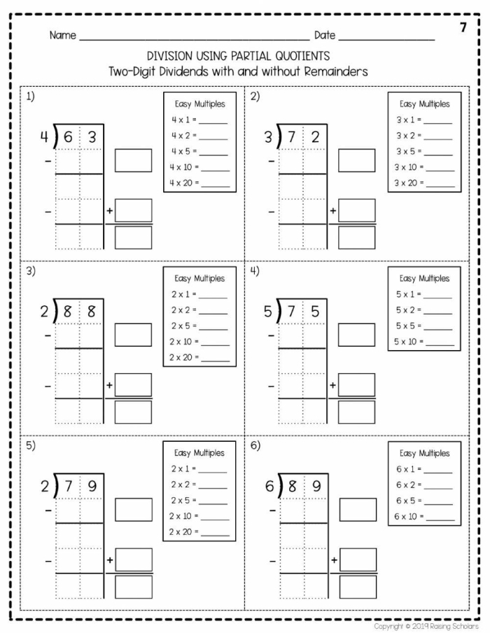 Fourth grade students practicing partial quotient division method with eight math problems on a worksheet