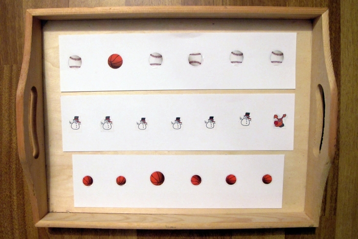 Pre-K students identifying community helpers to solve this Which of These Things Is Not Like the Other worksheet