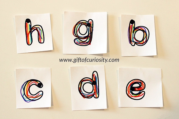 Pre-K student worksheet featuring lowercase alphabet practice with colorful rainbow-themed lettering for tracing