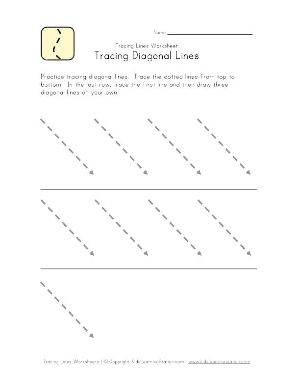 Pre-K student tracing dotted lines leading to a winter snow sled worksheet