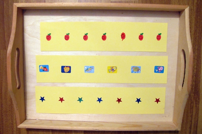 Preschoolers identifying the odd community helper out in a critical thinking place value worksheet