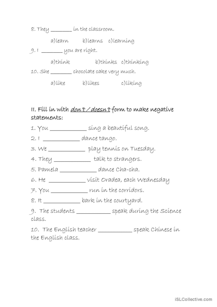 Second grade students completing a present tense challenge worksheet with regular and y-ending verbs