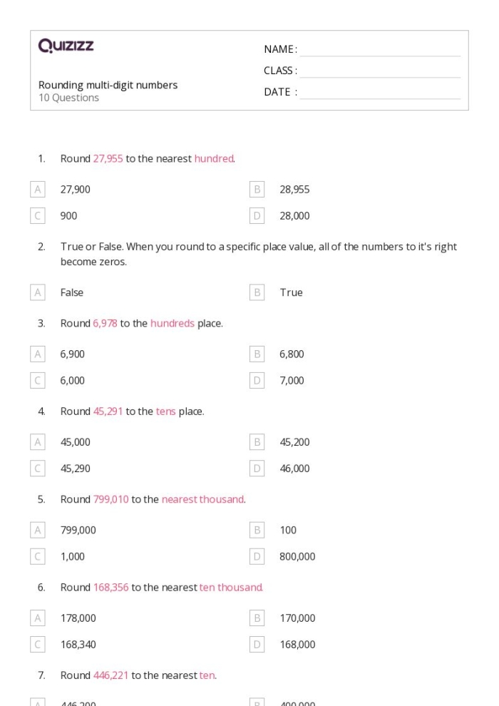 Fourth grade students practicing rounding multi-digit whole numbers on a math worksheet