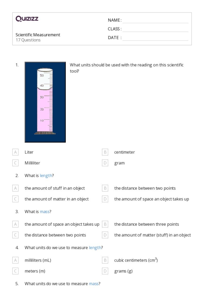 Second grade student using a ruler to complete a measurement practice test worksheet