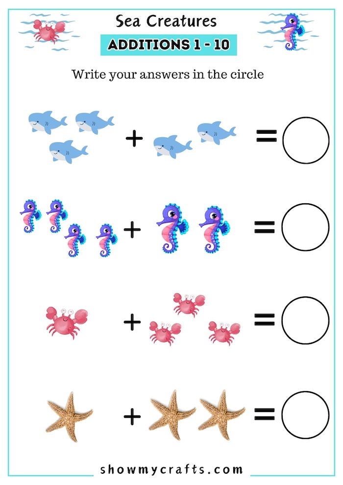Second grade student using a paper ruler to measure colorful sea creature illustrations on a worksheet