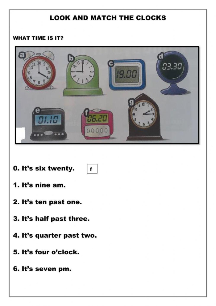Second grade students practicing time telling by connecting analog faces to digital times on a math worksheet