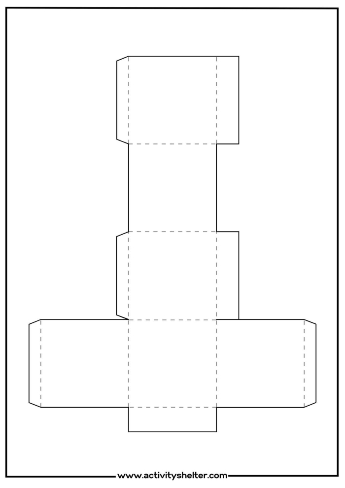 Second grade student working on a 3-D geometry cube cut-out project