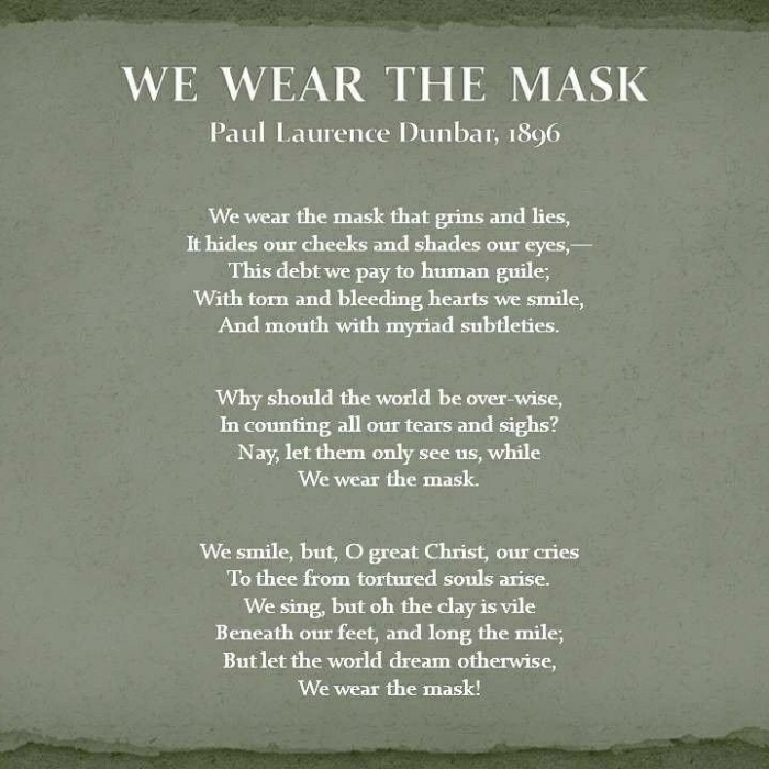 Seventh grade students using a poetry analysis worksheet to study We Wear the Mask by Paul Laurence Dunbar