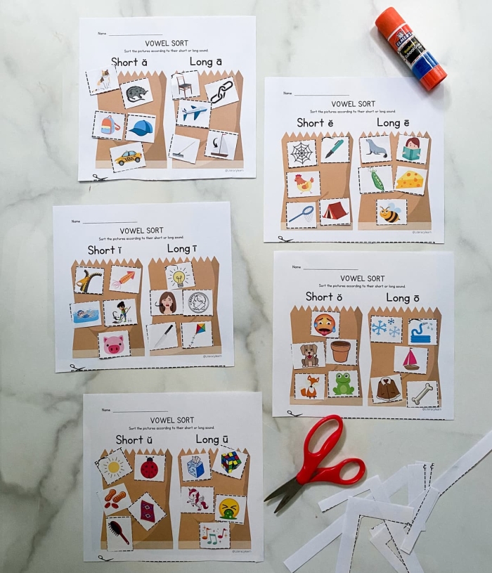 Sort the Short Vowels Worksheet Seven Pre-K student sorting short vowel sounds on a fun educational worksheet