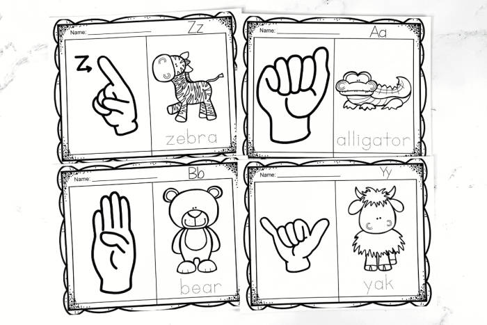 Second grade student practicing the sign language alphabet on a printable worksheet