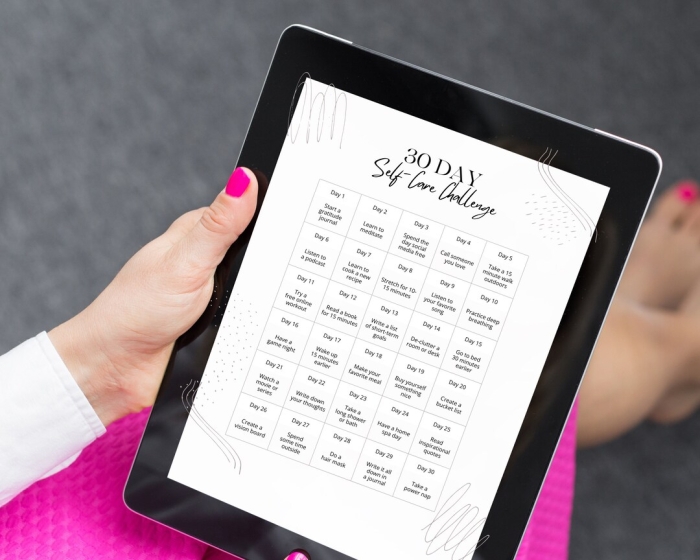 Sixth grade students filling out a 30-day self-care challenge worksheet for science class