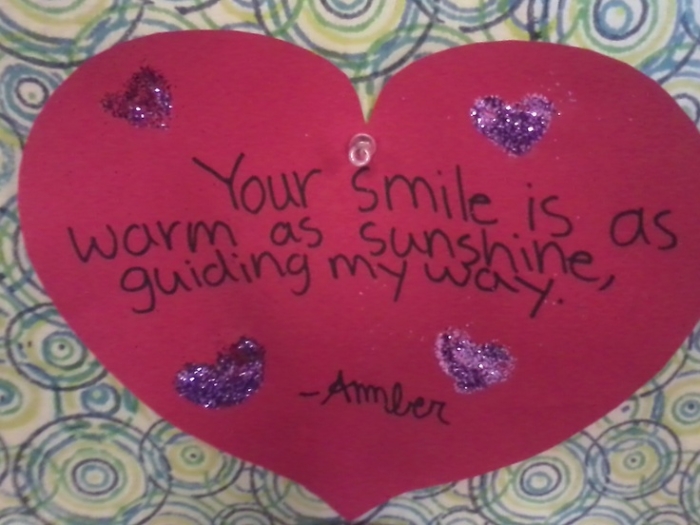 Sixth grade students solving a Valentine's Day similes maze worksheet with red hearts and romantic comparisons