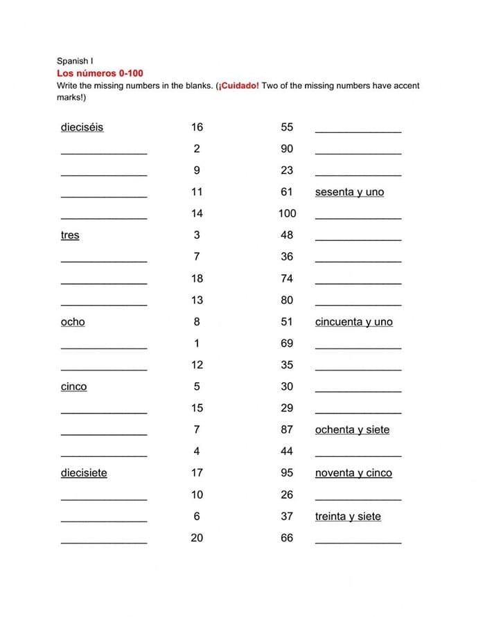 Second grade students practicing Spanish number writing using a 1-100 reference chart for lesson 16