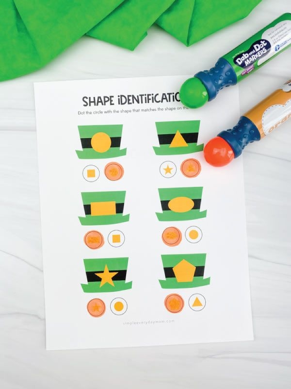 First grade student connecting the dots on a St. Patrick's Day rainbow and pot of gold algebra worksheet