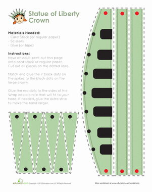A young student wearing a DIY paper Statue of Liberty crown for a kindergarten holiday reading lesson