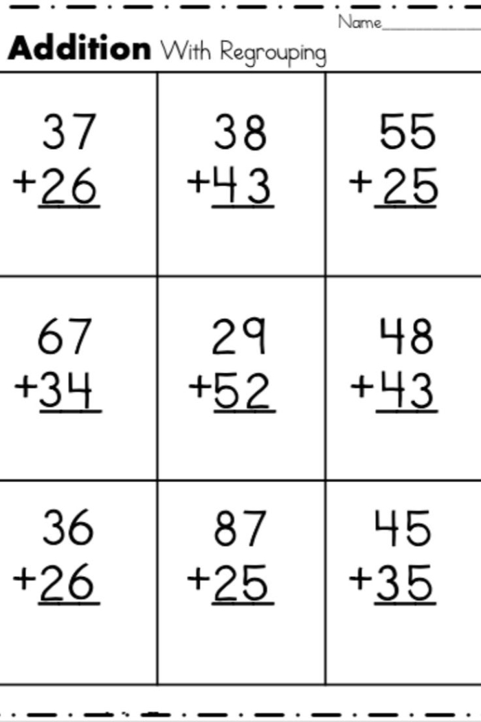 Third grade students solving addition problems with regrouping and carrying tens in columns