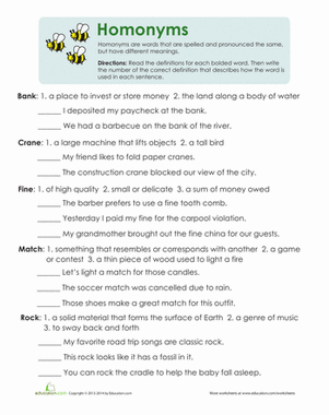 Third grade student completing a multiple meaning words worksheet with context clues