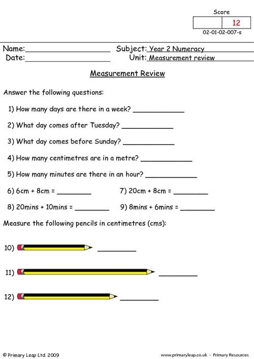 Measurement Review Test for Elementary Students Image 6 Third grade student completing a measurement review worksheet with rulers and measurement tools