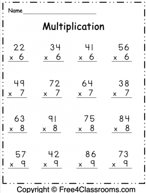 Third grade student practicing multiplication by 2 with a math worksheet and chart