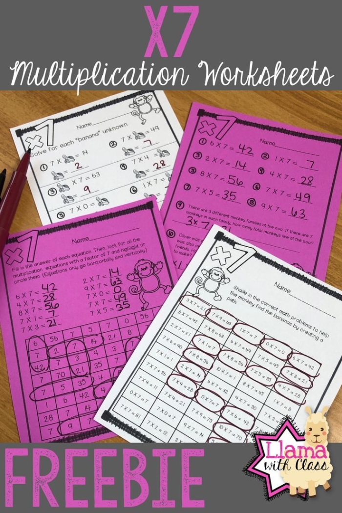Third grade student working on a math worksheet for multiplying by seven