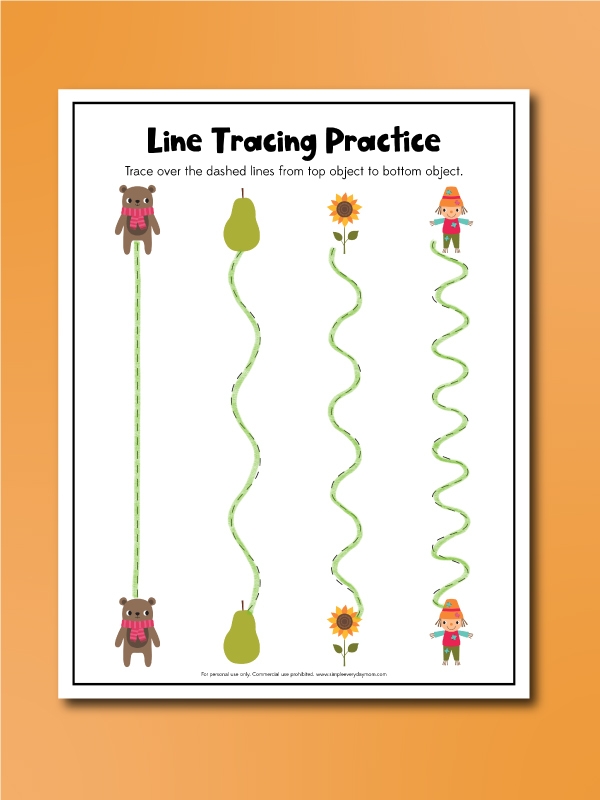 Children tracing lines from leaves to the ground on a Fall-themed worksheet
