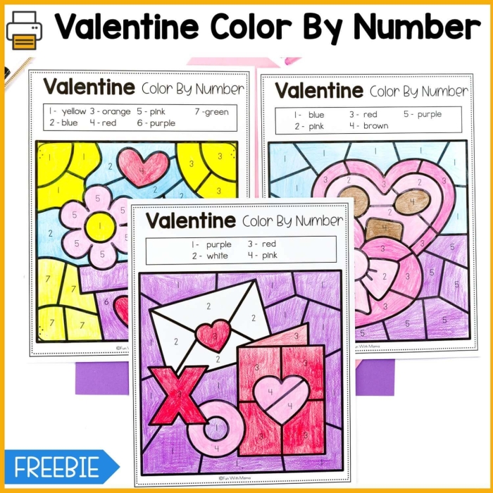 Preschooler coloring a heart-themed Valentine color-by-number worksheet featuring geometric shapes