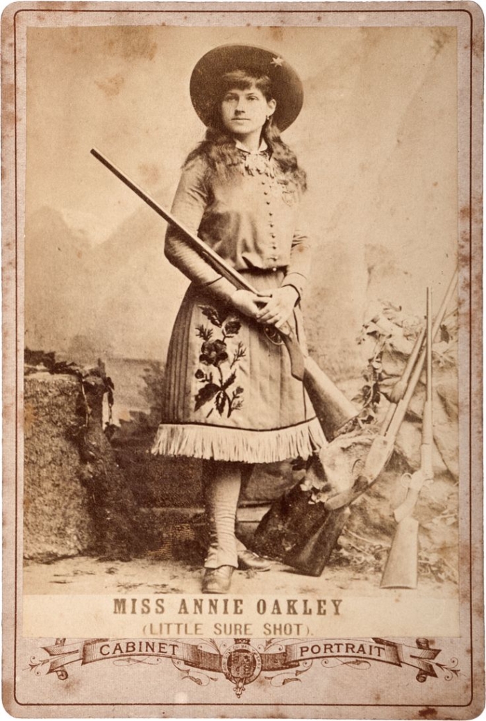 An educational worksheet featuring Annie Oakley, the famous sharpshooter from the Wild West
