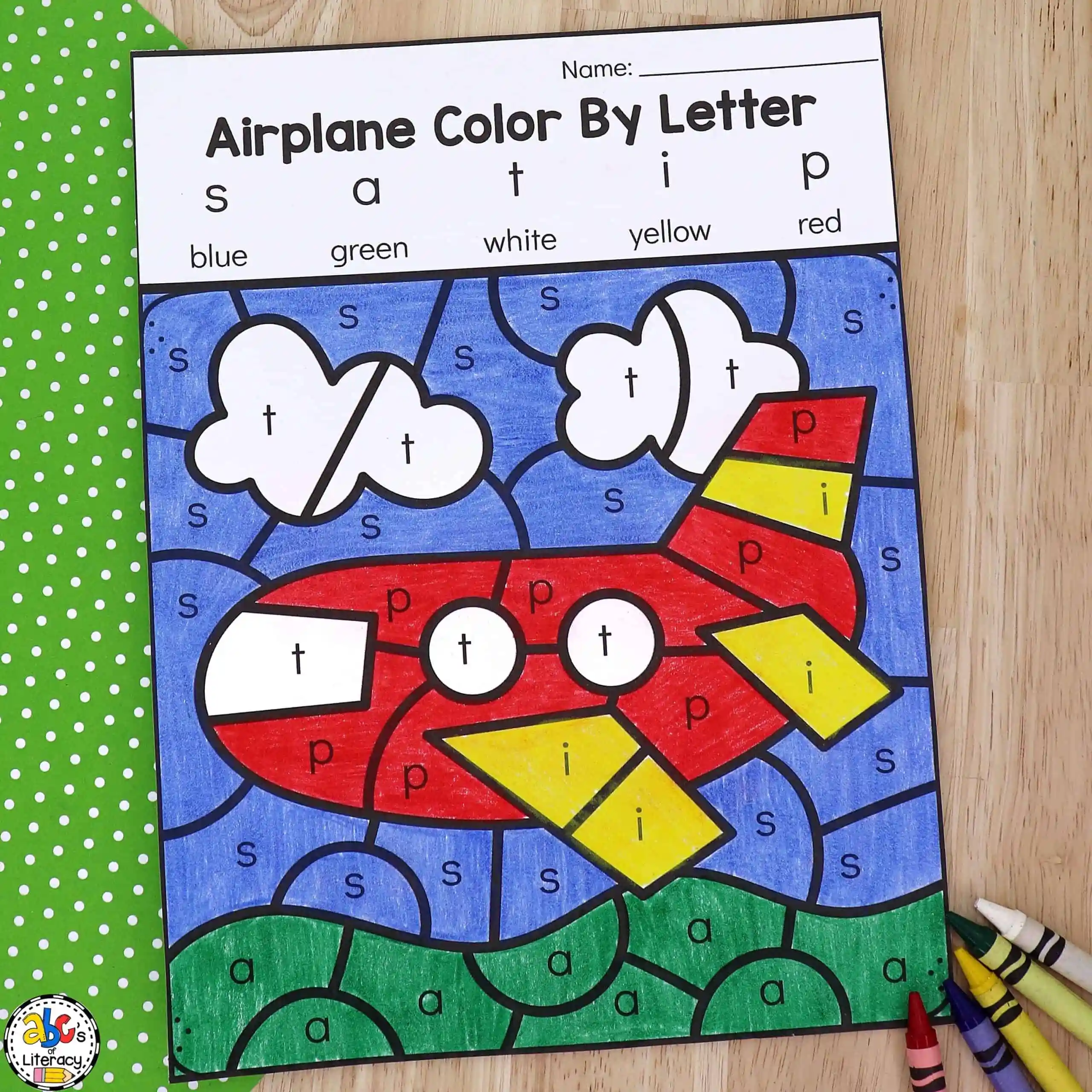Color by Letters worksheet for letter recognition and ABC practice, image 10 Kindergarten children coloring a worksheet that matches letters to colors to practice the alphabet