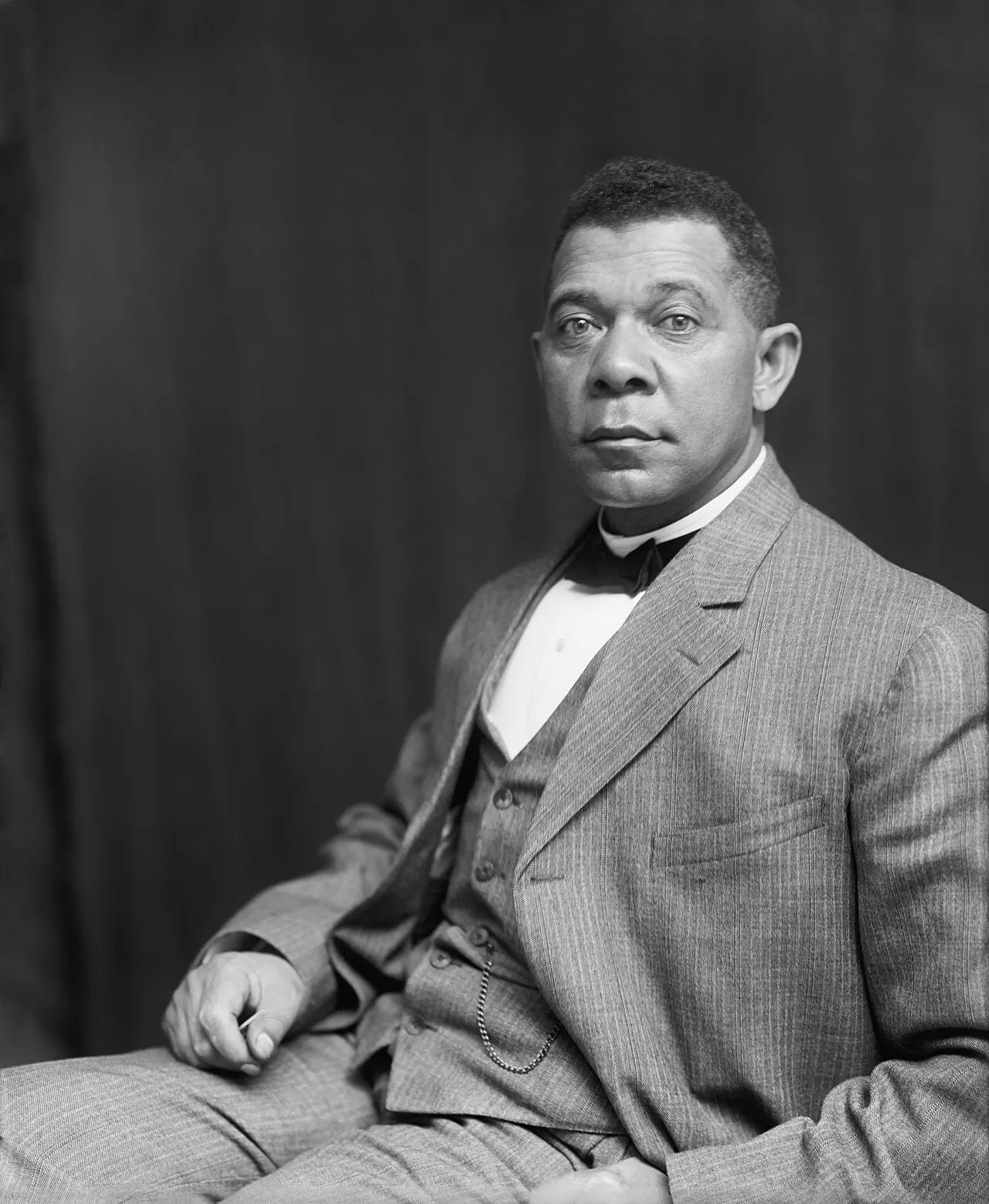 ALT text: Second grade worksheet about Booker T. Washington showing his journey from slavery to founding Tuskegee University and advocating for African American education and civil rights