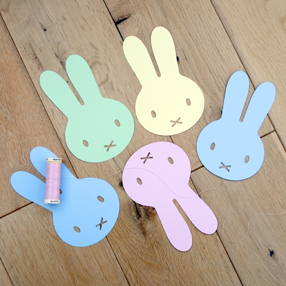Colorful Easter garland made from numbered paper shapes for second grade counting practice