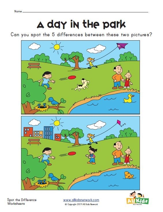 First grade children creating a colorful pop-up park with swings, slides, and animal trees in an arts and crafts activity