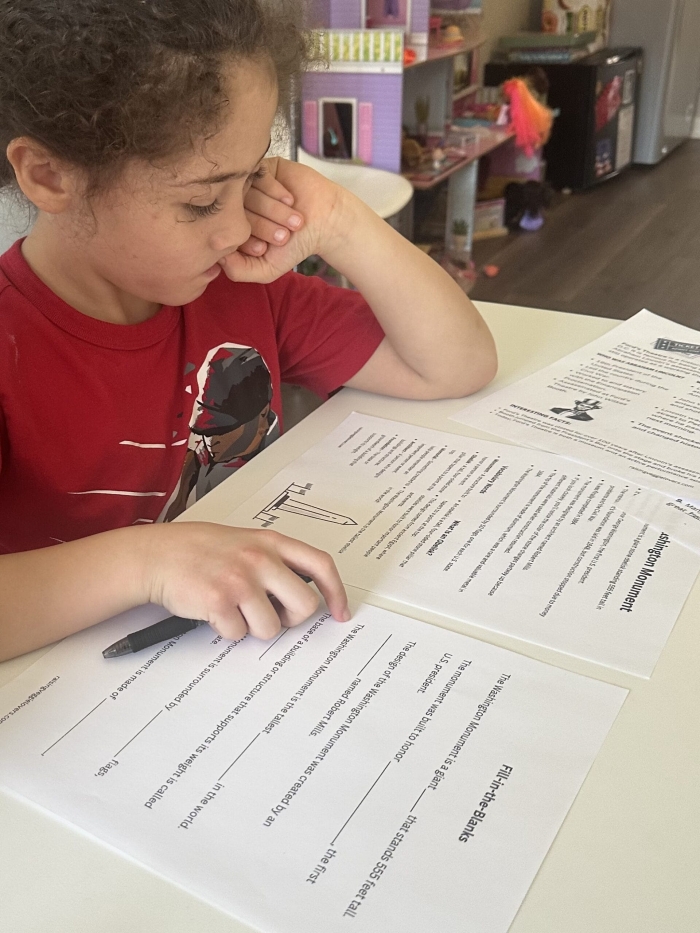 First Grade Washington Monument Model worksheet featuring a paper craft of the famous monument
