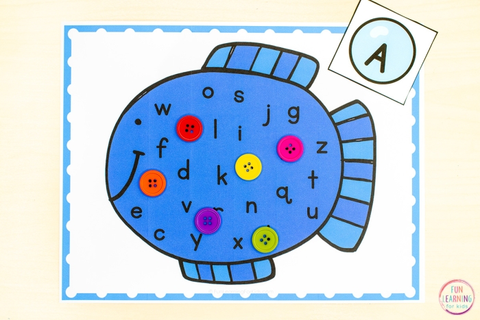 Ocean alphabet worksheet for finishing the fish letters in a fun time and money activity Kindergarten worksheet showing fish with missing lowercase letters to complete the alphabet