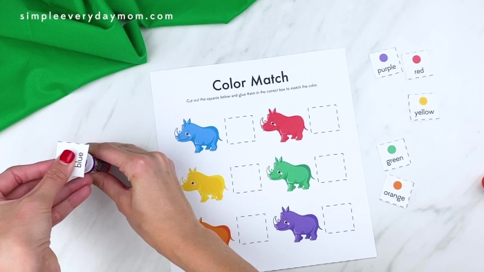 A kindergarten student drawing their favorite zoo animal from a poem about bears, camels, and wombats