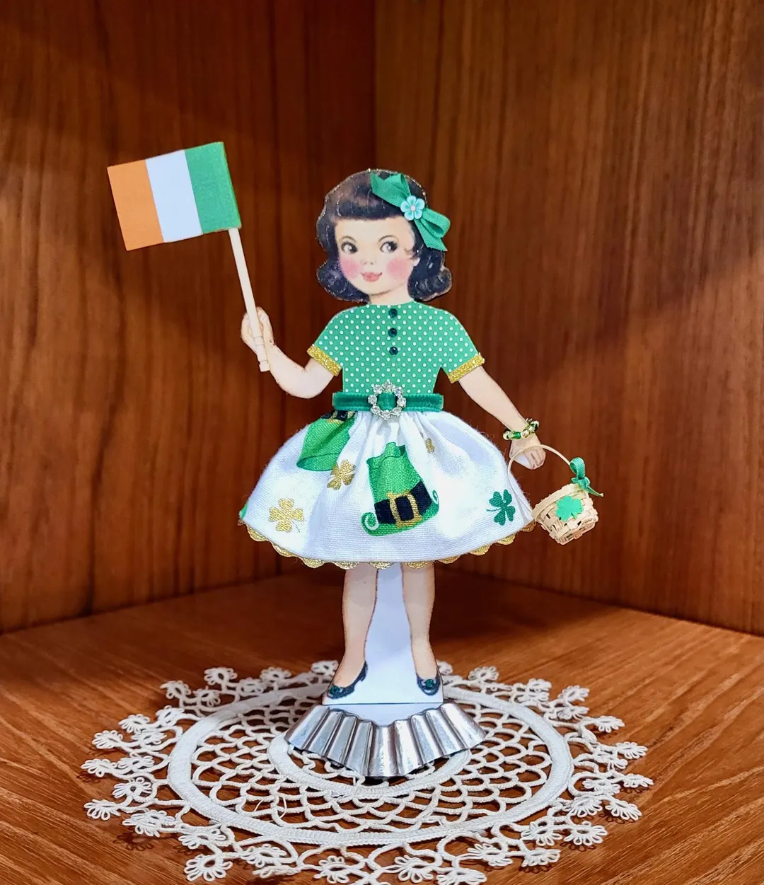 Pre-K St. Patrick's Day paper doll girl with colorful clothes for a fun grammar worksheet