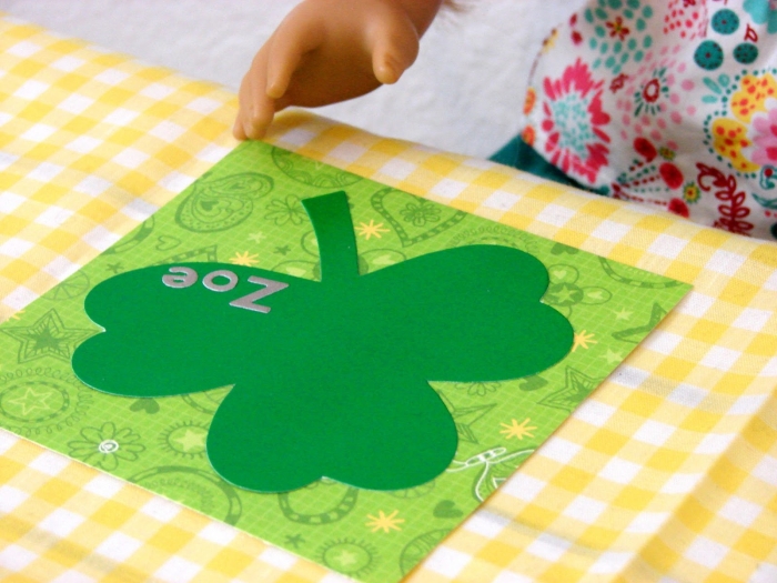 St. Patrick's Day themed paper doll girl with colorful holiday clothes for Pre-K learners