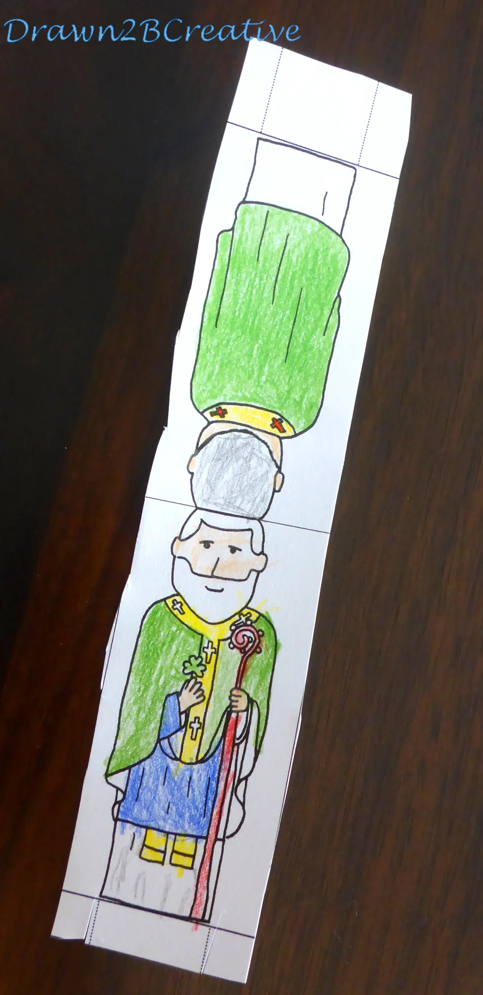 St. Patrick's Day themed paper doll girl with colorful holiday clothes for preschool grammar practice
