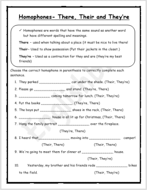 Second grade students filling out a homophones worksheet focusing on they're and their