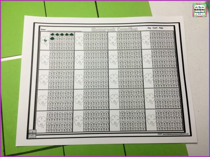 Shamrock Counting Practice for Early Learners Image 12 A kindergarten student counting green shamrocks in a St. Patrick's Day themed math activity