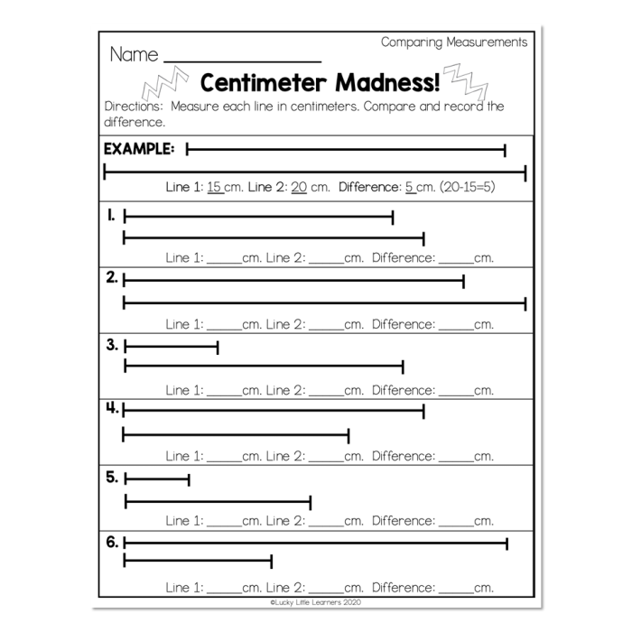 First grader measuring a sneaker using a ruler marked in centimeters