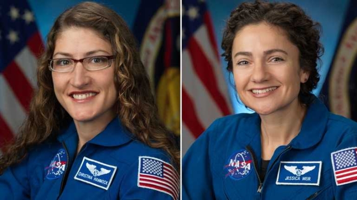 Worksheet on the historic first all-women spacewalk for second graders Two female astronauts conducting a spacewalk outside the International Space Station