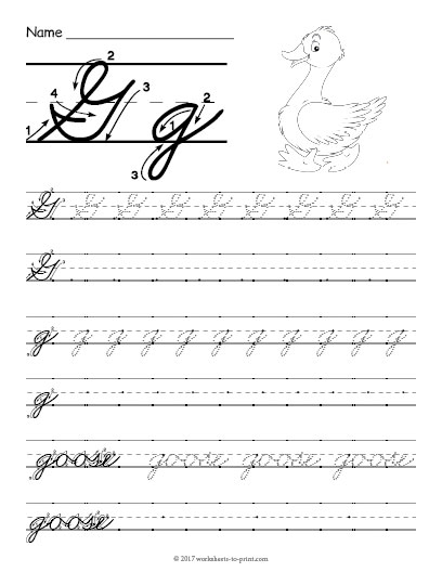 Third grade student practicing cursive G on a worksheet with guided lines