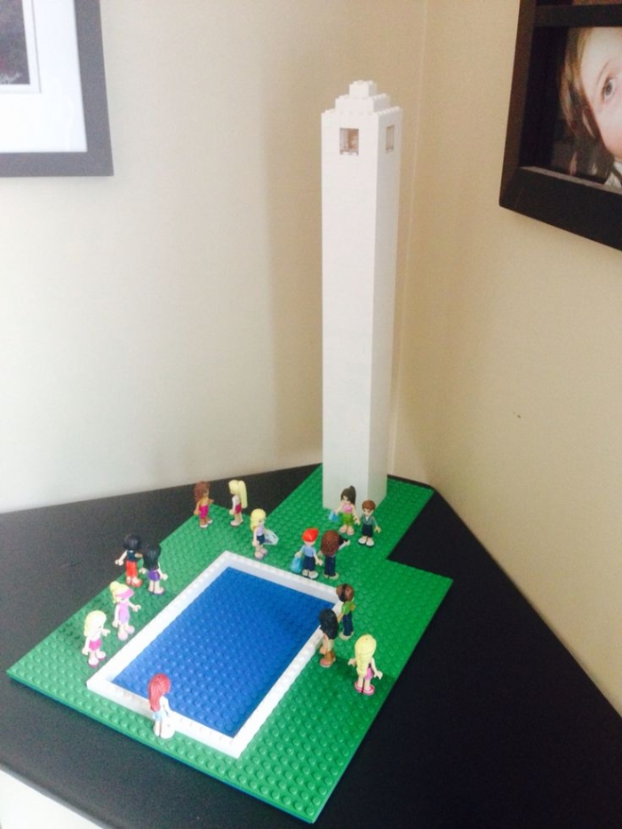 First Grade worksheet featuring a paper model of the Washington Monument for grammar and mechanics practice